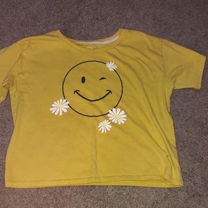 A shirt that has a smile face on jt